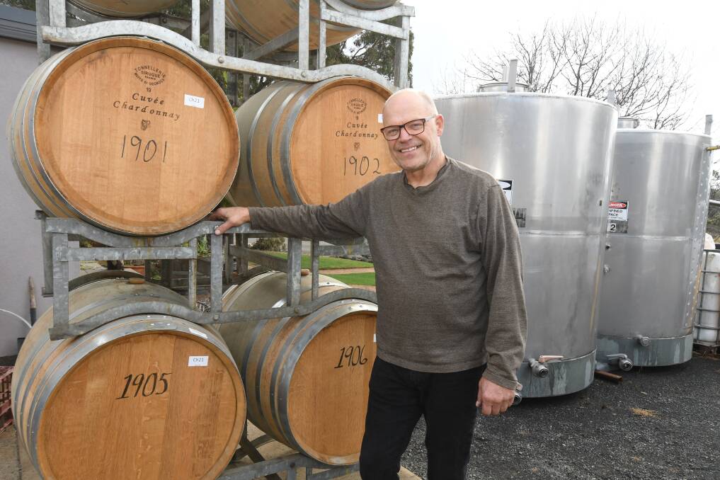 Owner of Orange's Patina Wines, Gerald Naef stands with his trusty oak barrels as local wine legend shortlisted in 2023 Halliday Wine Companion Winemaker of the Year. Picture by Jude Keogh.