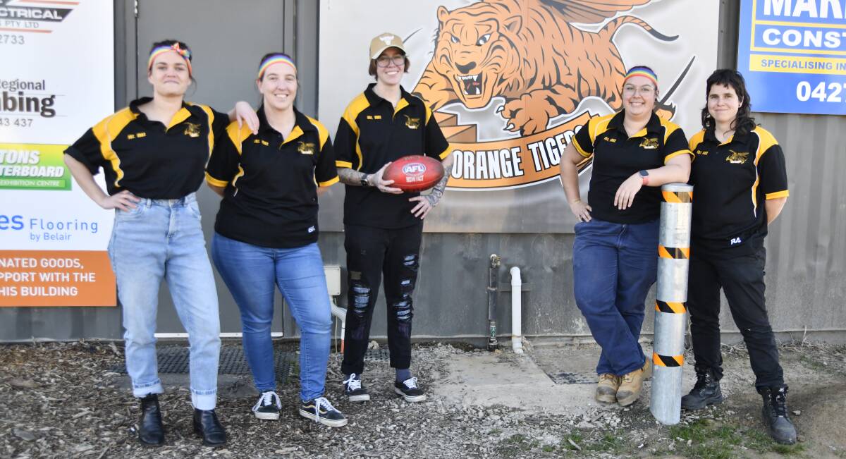 Penny Baker, Dael Bingham-Page, Sea Lindsay, Amy Murphy and Emily Moffat from the Orange Tigers are excited to celebrate Pride Round. Picture by Carla Freedman
