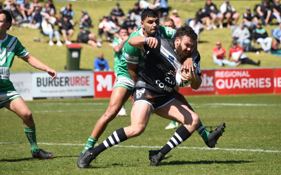 Cowra Magpies captain-coach Will Ingram is brought down by the CYMS defence during Sunday's reserve grade grand final. Picture by Amy McIntyre